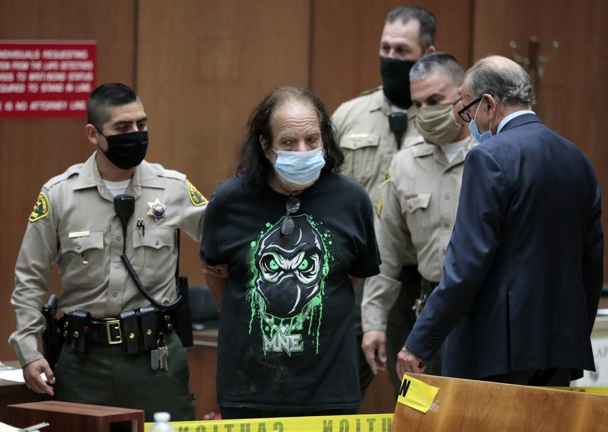 Adult film star Ron Jeremy, second left, with his attorney Stuart Goldfarb, right, makes his first appearance in Dept. 30 at Los Angeles Superior Court in Los Angeles, Tuesday, June 23, 2020. Los Ange ...