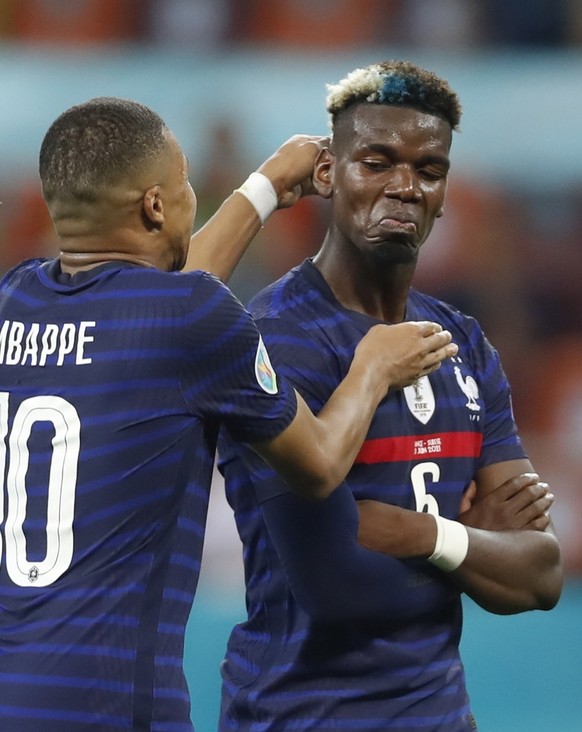 epa09309467 Paul Pogba (R) of France celebrates with teammate Kylian Mbappe after scoring the 3-1 lead during the UEFA EURO 2020 round of 16 soccer match between France and Switzerland in Bucharest, R ...