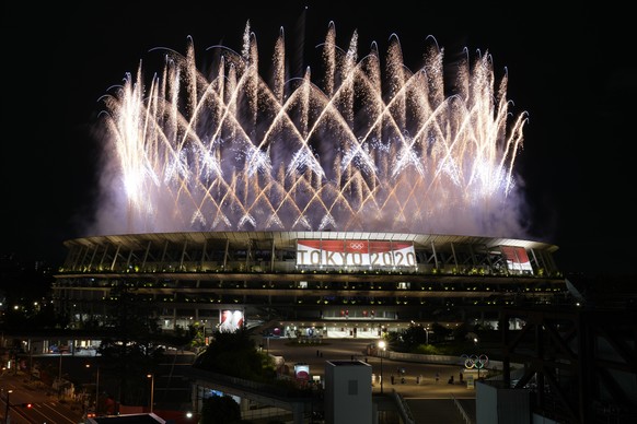 Fireworks illuminate over the National Stadium during the opening ceremony of the 2020 Summer Olympics, Friday, July 23, 2021, in Tokyo. (AP Photo/Shuji Kajiyama)