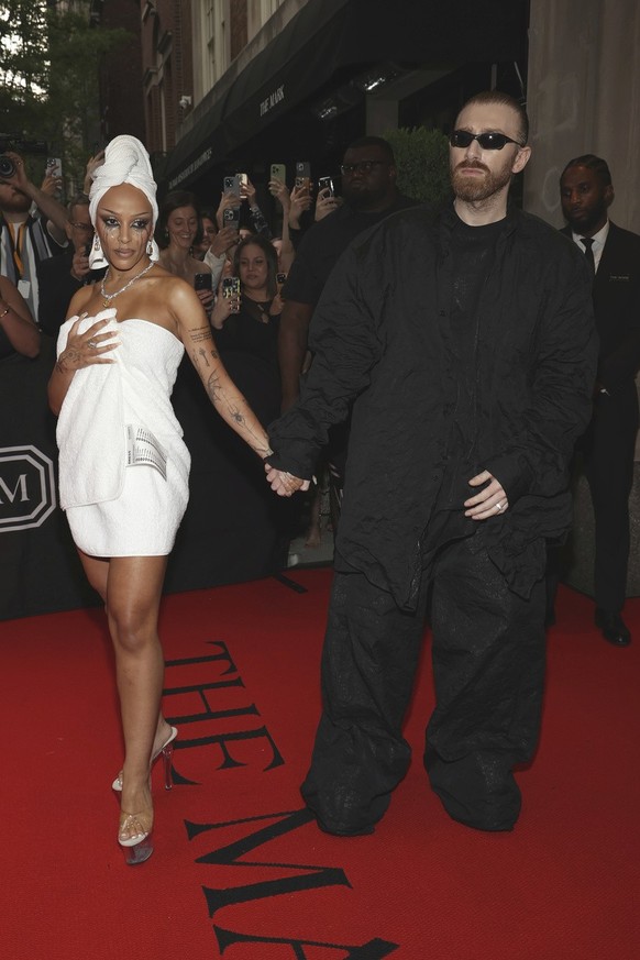 CORRECTS TO GURAM GVASALIA INSTEAD OF BEKA GVISHIANI - Doja Cat, left, and Guram Gvasalia depart The Mark Hotel prior to attending The Metropolitan Museum of Art&#039;s Costume Institute benefit gala  ...