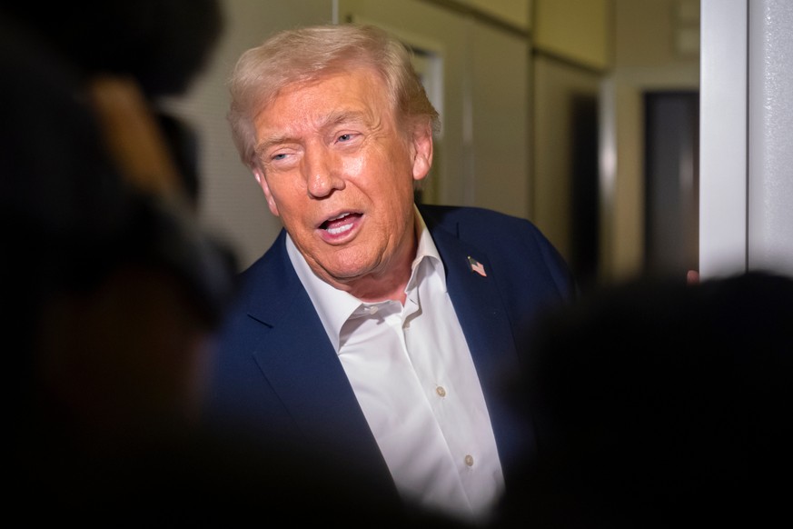 President Donald Trump speaks to reporters aboard Air Force One en route to Asia, Friday, Oct. 24, 2025. (AP Photo/Mark Schiefelbein)
Trump