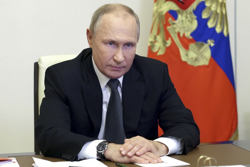 Russian President Vladimir Putin chairs a Security Council meeting via videoconference at the Novo-Ogaryovo residence outside Moscow, Russia, Wednesday, Oct. 19, 2022. Putin on Wednesday imposed marti ...