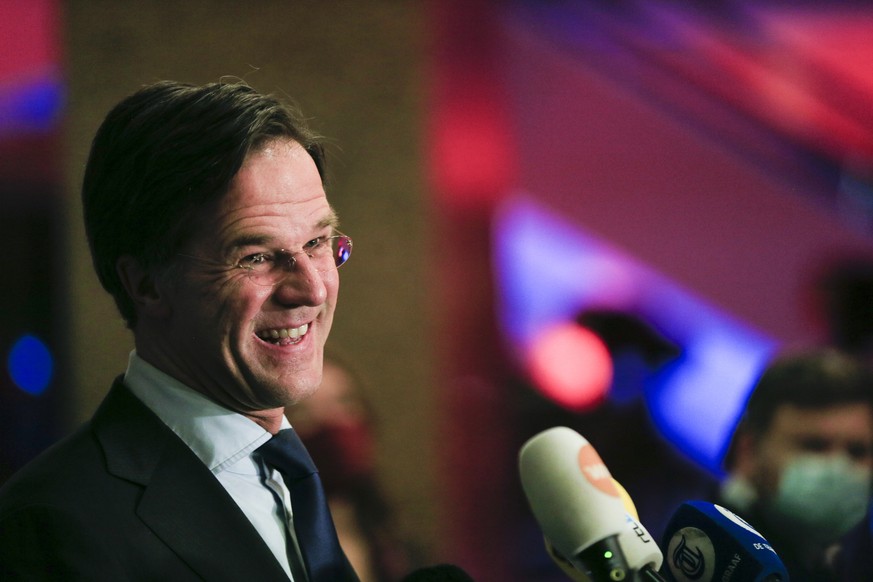 Dutch caretaker Prime Minister Mark Rutte speaks with the media following exit polls in the general election in The Hague, Netherlands, March 17, 2021. Dutch voters pushed Rutte towards a fourth term  ...