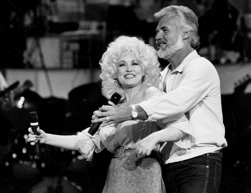 In this Sept. 27, 1983 photo, Country Music singers Dolly Parton and Kenny Rogers rehearse a song for their appearance on the TV show &amp;quot;Live... And in Person&amp;quot; in Los Angeles. Rogers,  ...