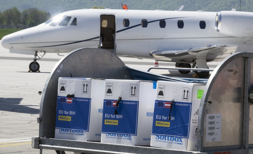 A container with boxes of the Pfizer vaccine delivered, at the Sarajevo Airport, Bosnia, Tuesday, May 4, 2021. The European Union has started delivering EU-funded coronavirus vaccines across the Balka ...