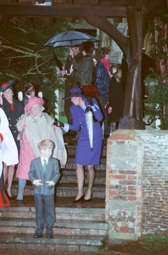 The Princess of Wales, Princess Diana, at Sandringham for the traditional church service and Royal family gathering, on a very windy Christmas Day 1990. Picture taken 25th December 1990. (Photo by Ken ...