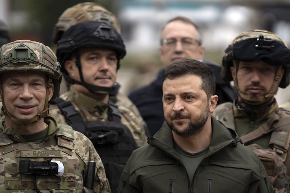 Ukrainian President Volodymyr Zelenskyy poses for a photo with soldiers after attending a national flag-raising ceremony in the freed Izium, Ukraine, Wednesday, Sept. 14, 2022. Zelenskyy visited the r ...