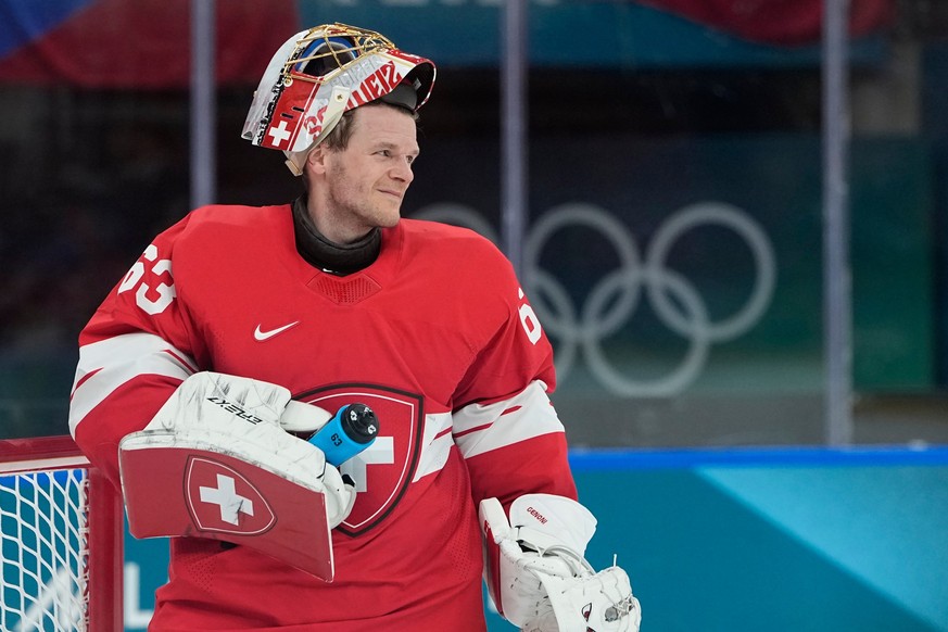 Switzerland's Leonardo Genoni (63) reacts during a preliminary round match of men's ice hockey between Switzerland and Czechia at the 2026 Winter Olympics, in Milan, Italy, Sunday, Feb. 15,  ...