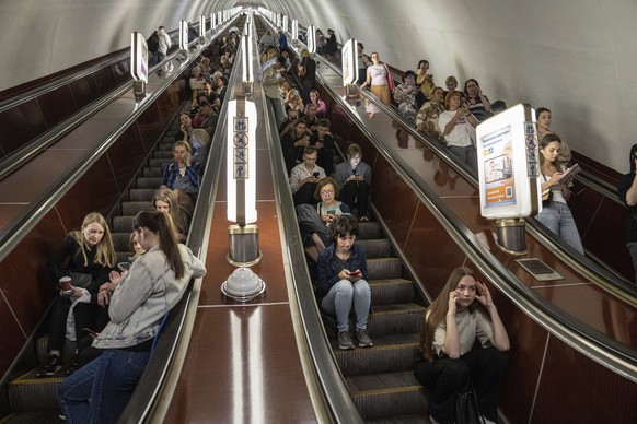 People take cover at a metro station during a Russian rocket attack in Kyiv, Ukraine, Monday, May 29, 2023. Explosions have rattled Kyiv during daylight as Russian ballistic missiles fell on the Ukrai ...