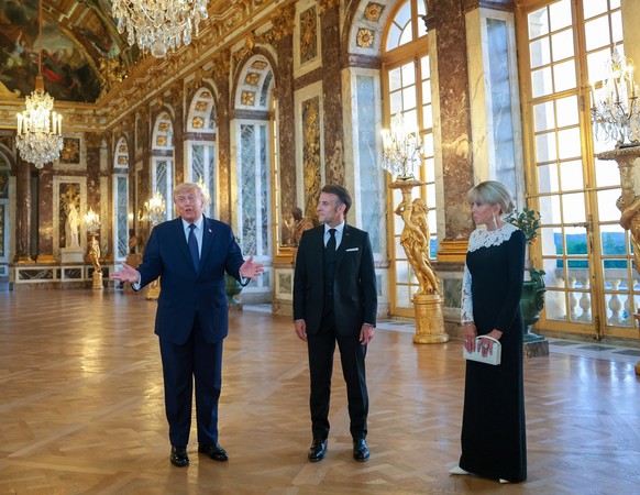 President Donald Trump receives a tour of Chateau de Versailles from President of France Emmanuel Macron and his wife Brigitte Macron ahead of a dinner on Wednesday, June 17, 2026 in Versailles, Franc ...