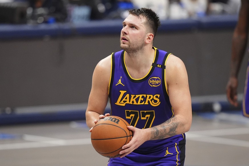 Los Angeles Lakers&#039; Luka Doncic shoots free throws in the second half of an NBA basketball game against the Dallas Mavericks in Dallas, Wednesday, April 9, 2025. (AP Photo/LM Otero)