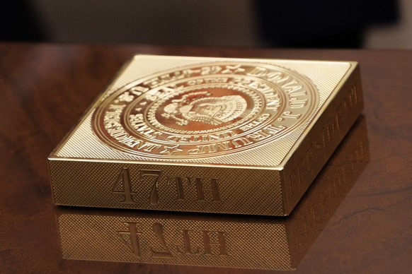 A Presidential decoration is seen on the coffee table in the Oval Office, as US President Donald Trump meets with the King of Jordan, Abdullah II Ibn Al-Hussein (not pictured) in the White House in Wa ...