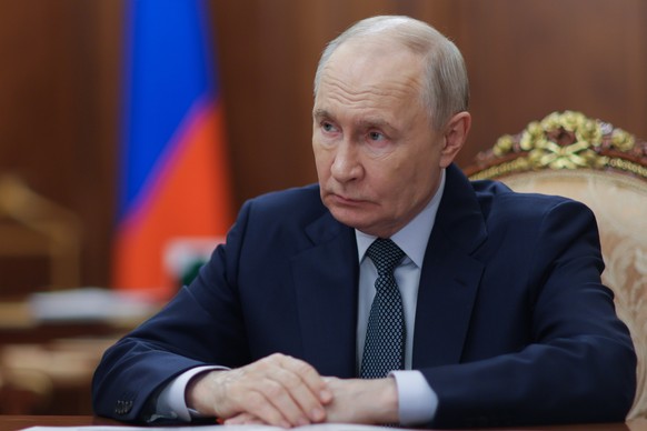 Russian President Vladimir Putin listens to the Governor of Nenets Autonomous Area Irina Gekht during their meeting at the Kremlin in Moscow, Monday, Aug. 17, 2026. (Mikhail Metzel, Sputnik, Kremlin P ...