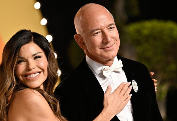 FILE - Lauren Sanchez and Jeff Bezos arrives at the Vanity Fair Oscar Party at the Wallis Annenberg Center for the Performing Arts in Beverly Hills, Calif., March 2, 2025. (Photo by Evan Agostini/Invi ...