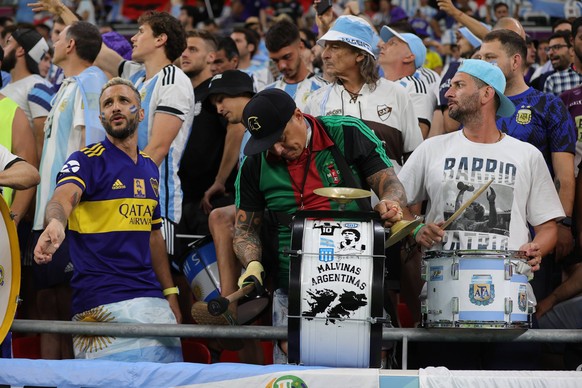 Argentina v Australia 2022 FIFA World Cup, WM, Weltmeisterschaft, Fussball Fans of Argentina with a drum making reference to the Malvinas their name for the Falkland Islands during the 2022 FIFA World ...