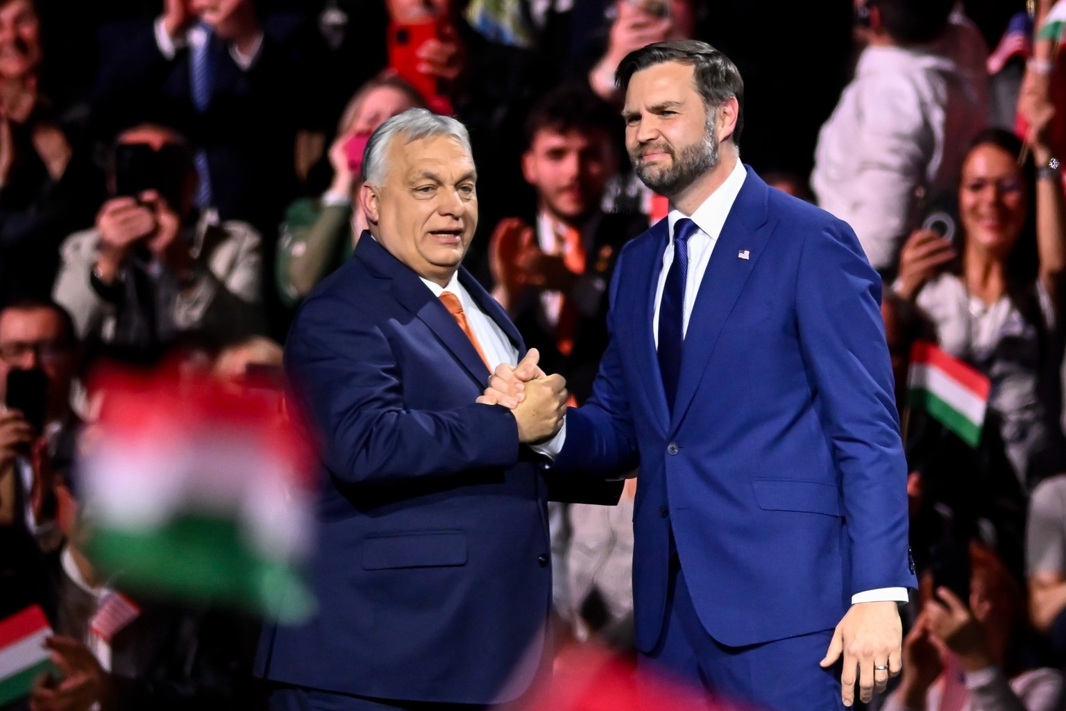 Hungary's Prime Minister Viktor Orban, left, and U.S. Vice President JD Vance shake hands at the end of a pre-election rally in Budapest, Hungary, Tuesday, April 7, 2026. (AP Photo/Denes Erdos)
J ...