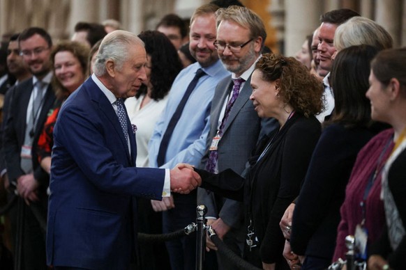 LONDON, ENGLAND - DECEMBER 14: King Charles III greets people as he visits The Royal Courts of Justice, Chancery Lane on December 14, 2023 in London, England. (Photo by Hannah McKay - WPA Pool/Getty I ...