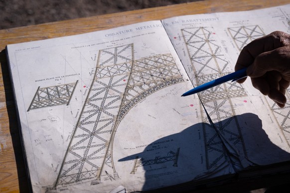 The former head of a metal parts manufacturing company Jean-Claude Fassler sits in front of his 30m Eiffel Tower replica in Sainte-Croix-aux-Mines, eastern France, on August 26, 2025. The former head  ...