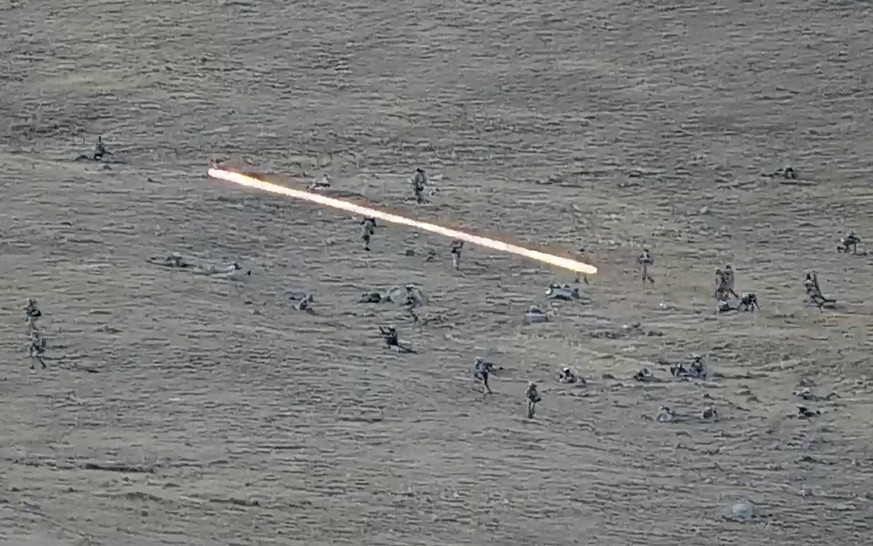 In this image taken from a YouTube footage released by Armenian Defense Ministry on Tuesday, Sept. 13, 2022, shows Azerbaijanian servicemen crossing the Armenian-Azerbaijani border and approaching the ...