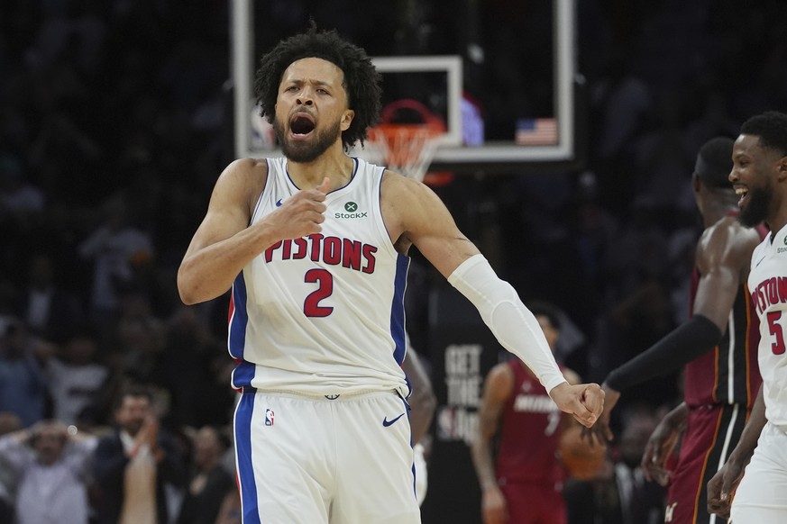Detroit Pistons guard Cade Cunningham (2) celebrates after scoring the winning basket during the second half of an NBA basketball game against the Miami Heat, Wednesday, March 19, 2025, in Miami. (AP  ...