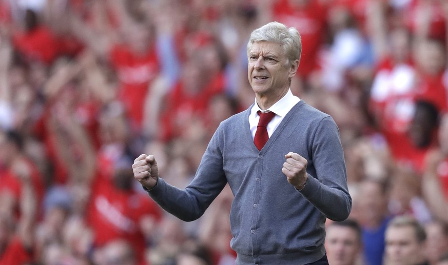 Arsenal's French manager Arsene Wenger celebrates his side's second goal during the English Premier League soccer match between Arsenal and Burnley at the Emirates Stadium in London, Sunday, ...