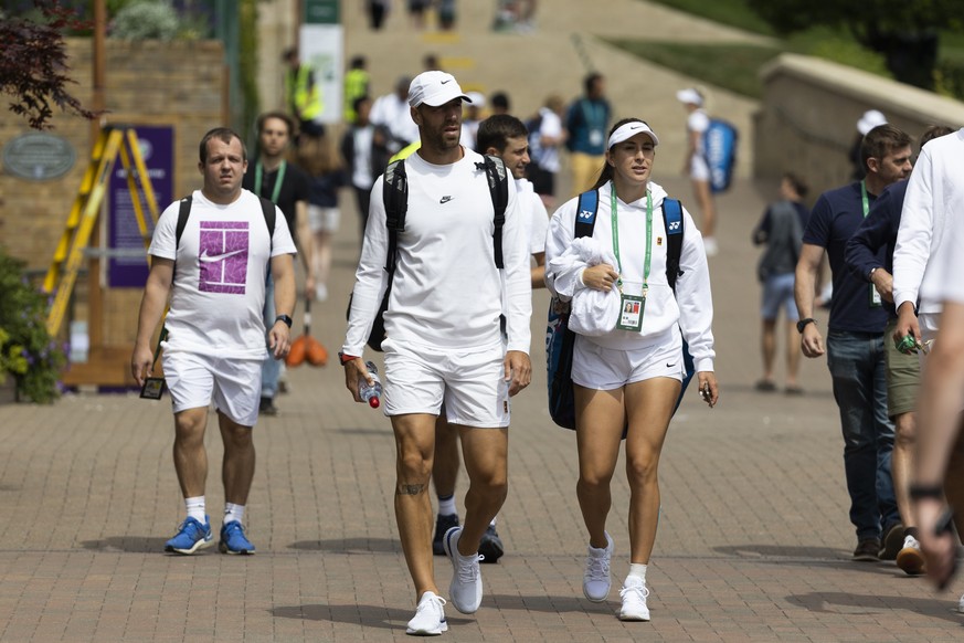 Belinda Bencic of Switzerland and fitness coach Martin Hromkovic, left, after a training session at the All England Lawn Tennis Championships in Wimbledon, London, Saturday, June 25, 2022. The Wimbled ...