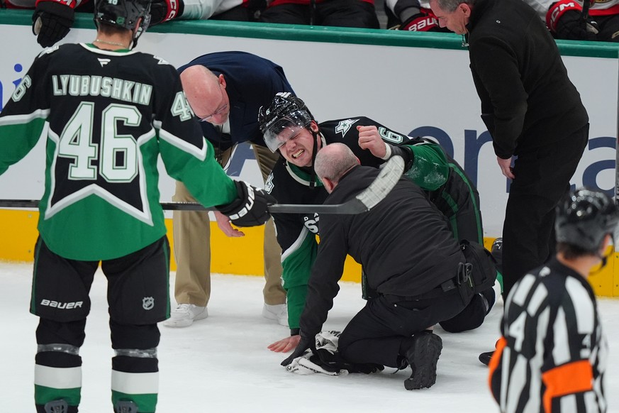 Dallas Stars defenseman Lian Bichsel (6) is helped after an injury during the second period of an NHL hockey game against the Ottawa Senators, Sunday, Nov. 30, 2025, in Dallas. (AP Photo/LM Otero)
Lia ...