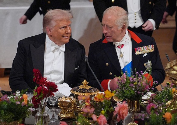 WINDSOR, ENGLAND - SEPTEMBER 17: US President Donald Trump and King Charles III during a State Banquet at Windsor Castle for the State visit by the President of the United States of America on Septemb ...