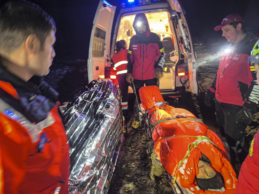 In this image provided by Salvamont Maramures, a Romanian mountain rescue service, 28 year-old Vladislav Duda from Ukraine, is loaded in an ambulance in the Carpathian Mountains , northern Romania, Fr ...