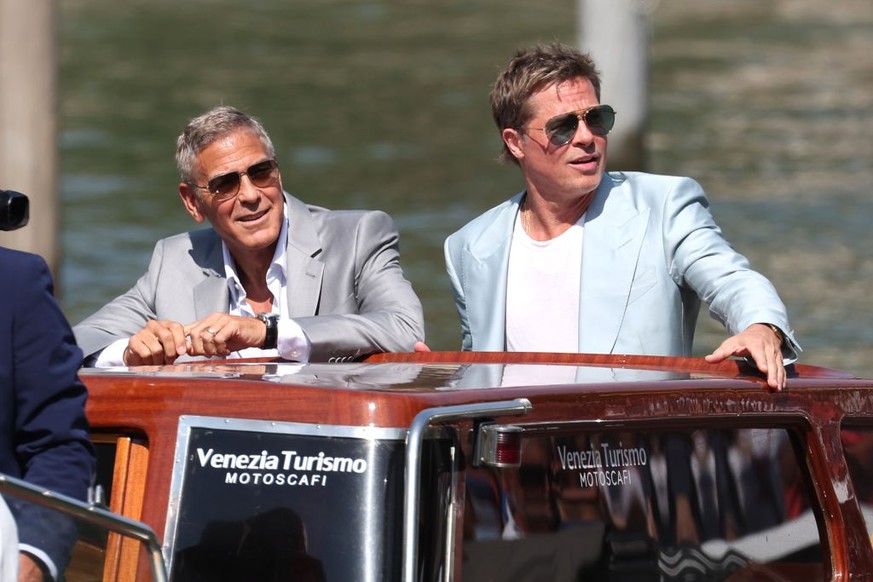 VENICE, ITALY - SEPTEMBER 1: George Clooney and Brad Pitt are seen at the pier of the Palazzo del Cinema during the 81st Venice International Film Festival on September 1, 2024 in Venice, Italy. (Phot ...