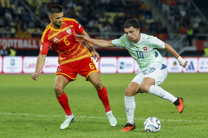 North Macedonia's Visar Musliu, left, fights for the ball with Switzerland's Zeki Amdouni, right, during the UEFA Nations League soccer match between North Macedonia and Switzerland at the T ...