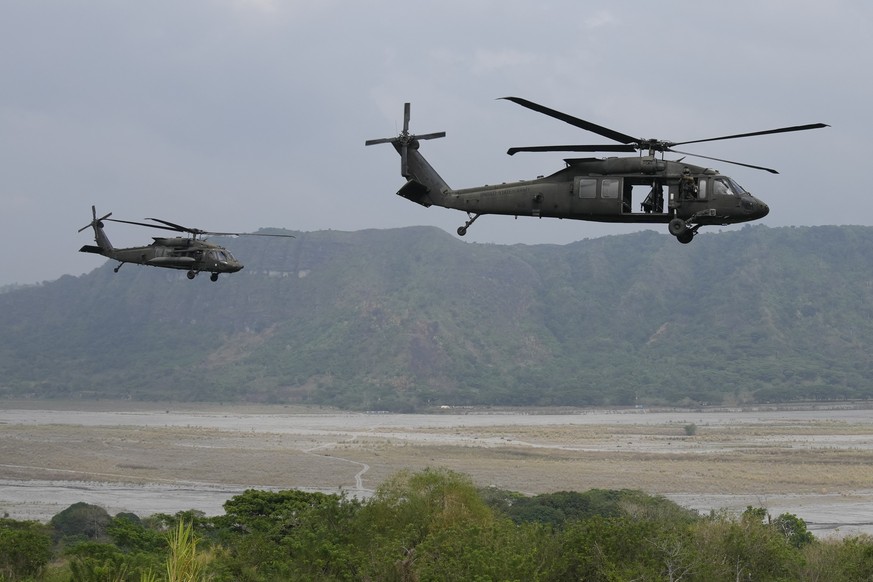 A U.S. Black Hawk helicopter perform maneuvers during a joint military exercise called &quot;Balikatan&quot;, Tagalog for shoulder-to-shoulder, at Capas, Tarlac province, northern Philippines, on Frid ...