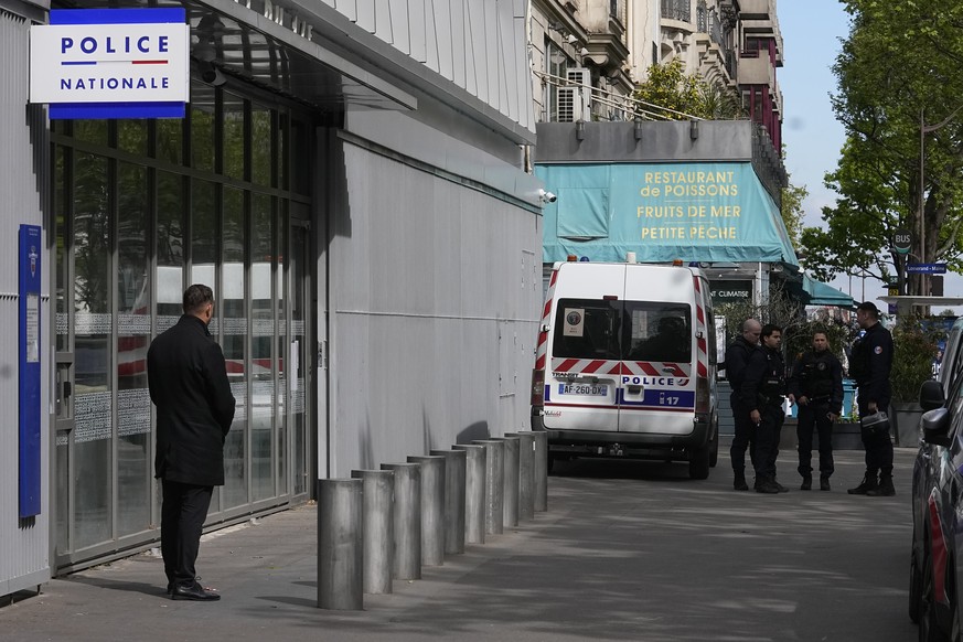 Police officers stand outside the police station where French actor Gerard Depardieu is expected to be questioned, Monday, April 29, 2024 in Paris. French media are reporting that police have summoned ...