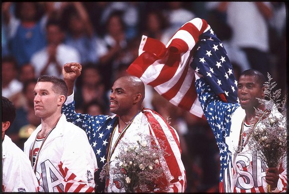 Aug 1992: Chris Mullin (L), Charles Barkley (M) and Magic Johnson (R) of Team USA, the Dream Team, on the victor&#039;s podium after winning the gold medal in the men&#039;s basketball competition at  ...