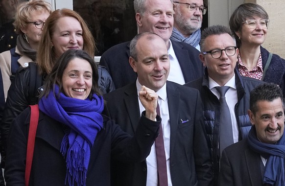 Newly elected CGT union secretary general Sophie Binet, left, CFDT union leader Laurent Berger, center, and other unions leaders pose before a meeting with French Prime Minister Elisabeth Borne, Wedne ...