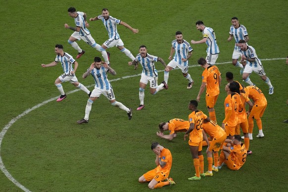 Argentina players celebrate at the end of the World Cup quarterfinal soccer match between the Netherlands and Argentina, at the Lusail Stadium in Lusail, Qatar, Saturday, Dec. 10, 2022. (AP Photo/Than ...