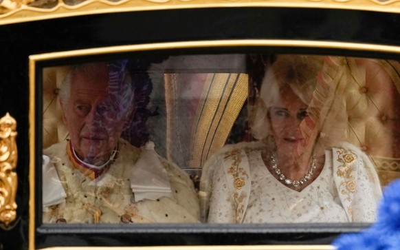 LONDON, ENGLAND - MAY 06: King Charles III and Camilla, Queen Consort travelling in the Diamond Jubilee Coach built in 2012 to commemorate the 60th anniversary of the reign of Queen Elizabeth II, flan ...