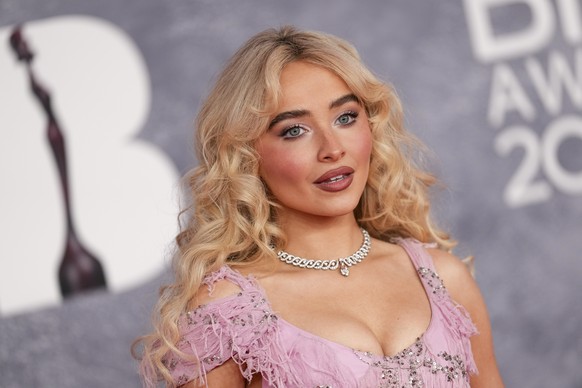 Sabrina Carpenter poses for photographers upon arrival at the Brit Awards 2025 in London, Saturday, March. 1, 2025. (Photo by Scott A Garfitt/Invision/AP)
Sabrina Carpenter