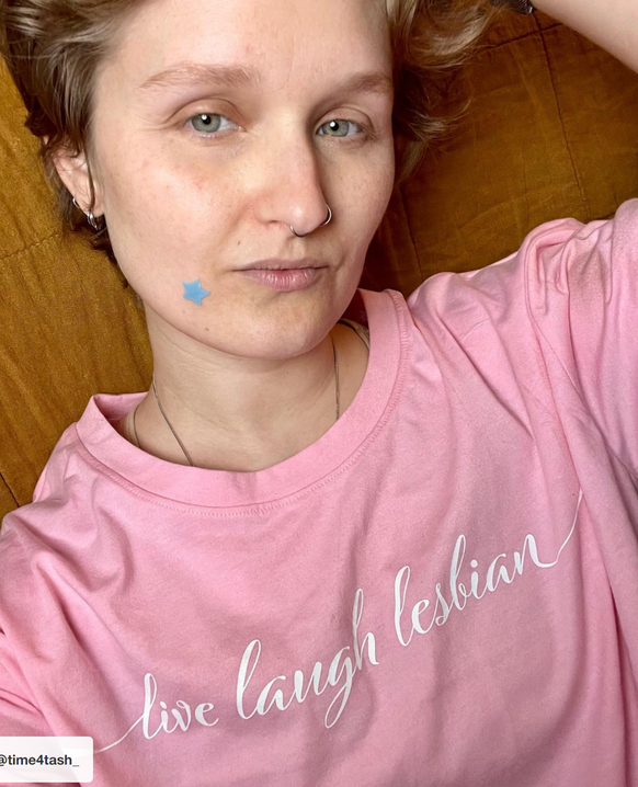 Pride merch Target pink Tshirt
live laugh lesbian 

https://www.target.com/finds/posts/vawUP7yKJa451YW8f2MyF1?lnk=tcom_pdp_product_carousel
