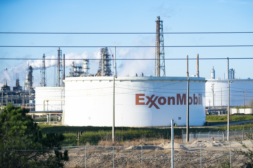 Smoke still fills the air at ExxonMobil���s refinery on Thursday, Dec. 23, 2021 in Baytown, Texas. Crews have extinguished a large fire at a Houston-area refinery that left four people injured. (Mark  ...