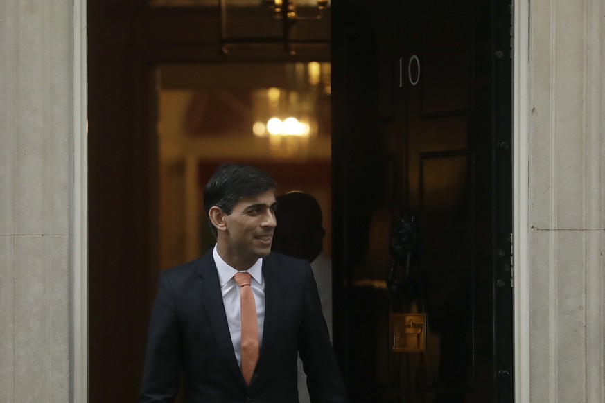 FILE - Britain&#039;s new Chancellor of the Exchequer Rishi Sunak leaves 10 Downing Street, in London, Thursday, Feb. 13, 2020. Two people are running to be Britain���s next prime minister, but a thir ...