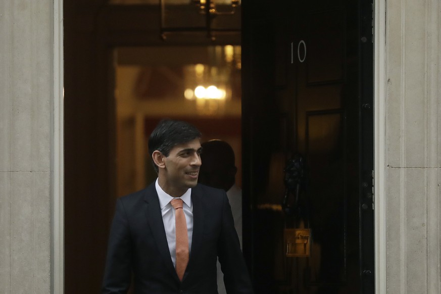 FILE - Britain&#039;s new Chancellor of the Exchequer Rishi Sunak leaves 10 Downing Street, in London, Thursday, Feb. 13, 2020. Two people are running to be Britain���s next prime minister, but a thir ...