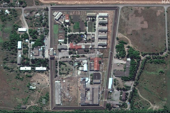 FILE - In this satellite photo provided by Maxar Technologies, a view of the Olenivka detention center, in Eastern Donetsk province, after an attack on the prison reportedly killed Ukrainian soldiers  ...