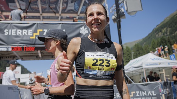 Oria Liaci from Switzerland, women&#039;s 8th placed, celebrates on the finish line during the 51st Sierre-Zinal long distance mountain race in Zinal, Saturday, August 10, 2024. Approximately 6300 par ...