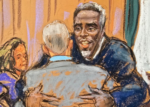 Sean &quot;Diddy&quot; Combs embraces his attorneys before jury questioning got underway in his sex trafficking trial in New York City, New York, U.S., May 5, 2025 in this courtroom sketch. REUTERS/Ja ...