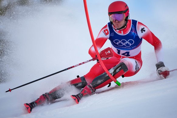 Switzerland's Tanguy Nef speeds down the course of an alpine ski men's slalom portion of a team combined race, at the 2026 Winter Olympics, in Bormio, Italy, Monday, Feb. 9, 2026. (AP Photo/ ...