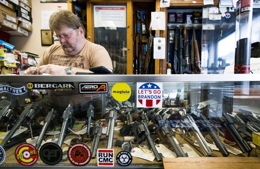 epa10037602 Keith Nicholson, works on repairing a handgun trigger mechanism at Shoot and Latters LLC, his gun store and gunsmith shop in Suffern, New York, USA, 27 June 2022. Last week the United Stat ...