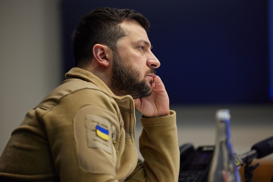 epa09912708 A handout photo made available by the Ukrainian Presidential Press Service shows Ukrainian President Volodymyr Zelensky during a meeting with his cabinet and visiting parliamentary delegat ...