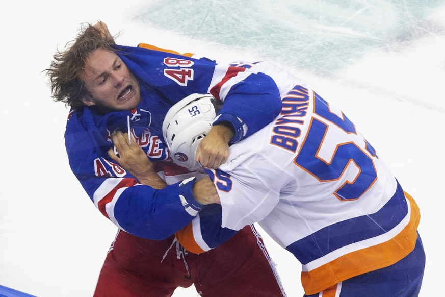 New York Rangers left wing Brendan Lemieux (48) and New York Islanders defenseman Johnny Boychuk (55) fight during the first period of an NHL hockey exhibition game in Toronto on Wednesday, July 29, 2 ...