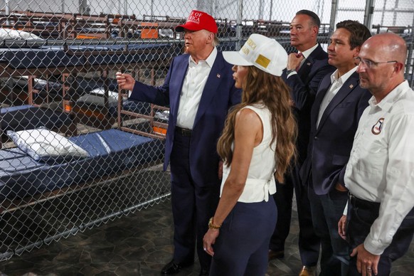 U.S. President Donald Trump, Florida Governor Ron DeSantis and U.S. Homeland Security Secretary Kristi Noem visit a temporary migrant detention center informally known as &quot;Alligator Alcatraz&quot ...